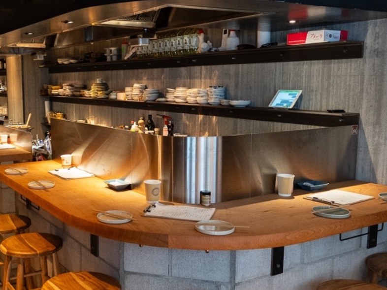 Counter seats facing the grill at YAOYA TOKYO